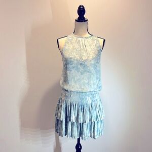 Sleeveless dress, soft pleating, stretch smocking at waist/hips, tiered skirt.